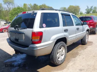 2004 Jeep Grand Cherokee Laredo with VIN 1J4GW48S74C260968, listed as a IAAI auction lot 42050628 with 192,602 mi miles. Bid and sale history available at carsss.com. Image 4.