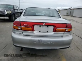 2002 Saturn LS z VIN 1G8JU54F92Y571764, wystawiony jako Copart lot #75098934 z przebiegiem Nie podano mil oraz Nie do naprawy. Historia ofert i sprzedaży dostępna na DreamBid. Obrazek 6.