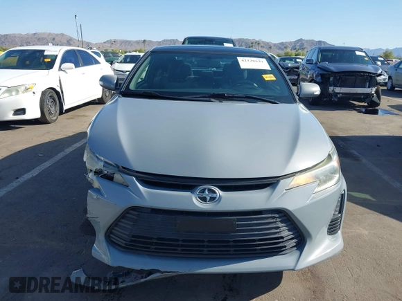 2015 Scion tC with VIN JTKJF5C7XFJ012872, listed as a IAAI auction lot 42128621 with 100,832 mi miles. Bid and sale history available at carsss.com. Image 13.