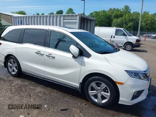 2018 Honda Odyssey EX-L z VIN 5FNRL6H75JB036479, wystawiony jako IAAI lot #42275582 z przebiegiem 77 454 mil mil oraz . Historia ofert i sprzedaży dostępna na DreamBid. Obrazek 1.