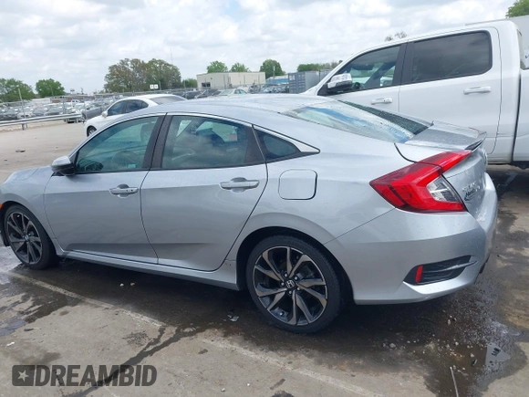 2021 Honda Civic Sport with VIN 2HGFC2F88MH530214, listed as a IAAI auction lot 41968361 with 60,869 mi miles and . Bid and sale history available at DreamBid. Image 14.