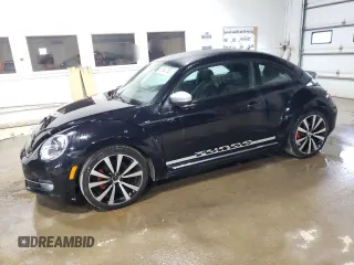 2012 Volkswagen Beetle 2.0T Turbo w/Sun/Snd/Nav PZEV with VIN 3VWVA7AT9CM604665, listed as a Copart auction lot 51984735 with 111,938 mi miles and Clean Title. Bid and sale history available at carsss.com. Image 1.