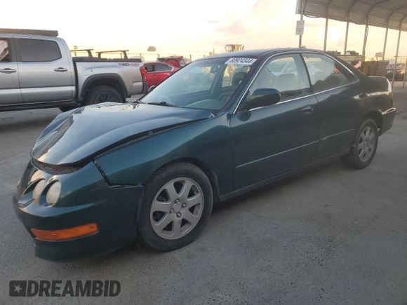 1999 Acura Integra with VIN JH4DB7665XS000928, listed as a Copart auction lot 80924344 with 198,981 mi miles and Salvage title. Bid and sale history available at DreamBid. Image 1.