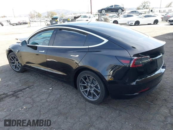 2019 Tesla Model 3 Mid Range with VIN 5YJ3E1EA1KF410297, listed as a IAAI auction lot 41841991 with 176,254 mi miles. Bid and sale history available at carsss.com. Image 3.