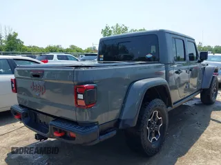 2021 Jeep Gladiator Rubicon with VIN 1C6JJTBG2ML515932, listed as a IAAI auction lot 42471704 with 57,775 mi miles and . Bid and sale history available at DreamBid. Image 4.