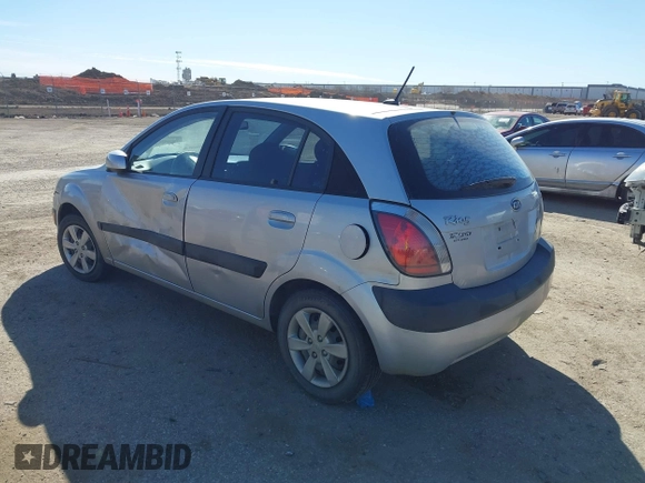 2009 Kia Rio LX with VIN KNADE243596530314, listed as a IAAI auction lot 41681050 with 114,831 mi miles. Bid and sale history available at carsss.com. Image 3.