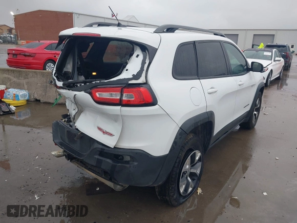 2015 Jeep Cherokee Trailhawk with VIN 1C4PJMBB1FW630519, listed as a IAAI auction lot 41605466 with 219,390 mi miles and . Bid and sale history available at carsss.com. Image 4.