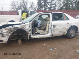2002 Cadillac DeVille DHS z VIN 1G6KE57YX2U212020, wystawiony jako IAAI lot #41287342 z przebiegiem Nie podano mil oraz . Historia ofert i sprzedaży dostępna na DreamBid. Obrazek 6.