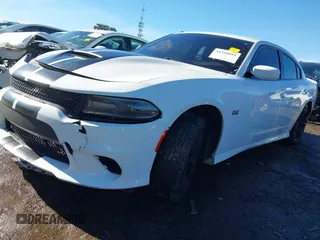 2020 Dodge Charger R/T with VIN 2C3CDXCT5LH159956, listed as a IAAI auction lot 41310991 with 127,743 mi miles and . Bid and sale history available at carsss.com. Image 2.