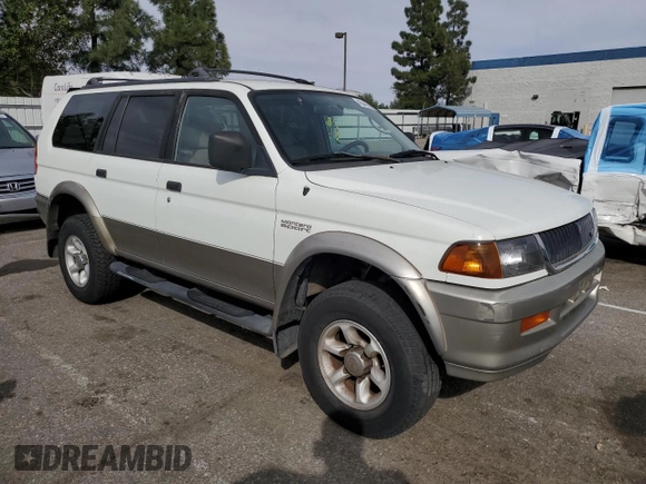 1999 Mitsubishi Montero LS z VIN JA4LS31H2XP037110, wystawiony jako Copart lot #45447485 z przebiegiem 166 942 mil mil oraz Szkoda całkowita • Salvage title. Historia ofert i sprzedaży dostępna na DreamBid. Obrazek 4.