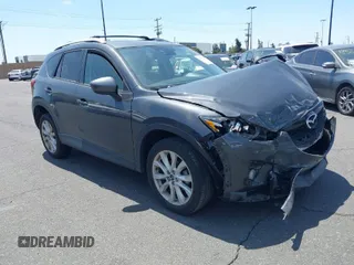 2014 Mazda CX-5 Grand Touring with VIN JM3KE4DY8E0391317, listed as a IAAI auction lot 41871641 with 77,048 mi miles. Bid and sale history available at carsss.com. Image 1.