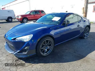 2013 Scion FR-S with VIN JF1ZNAA11D2702415, listed as a IAAI auction lot 40381041 with 63,581 mi miles. Bid and sale history available at carsss.com. Image 2.