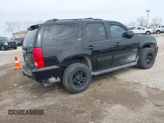 2013 GMC Yukon SLT with VIN 1GKS2CE01DR135135, listed as a IAAI auction lot 41828474 with 180,347 mi miles. Bid and sale history available at carsss.com. Image 4.
