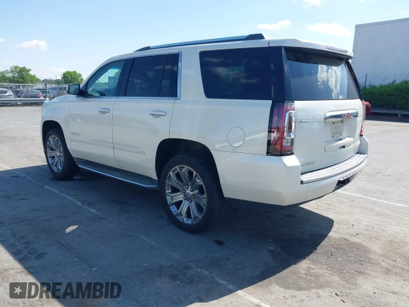 2015 GMC Yukon Denali with VIN 1GKS1CKJ3FR230797, listed as a IAAI auction lot 41977294 with 174,633 mi miles. Bid and sale history available at carsss.com. Image 3.