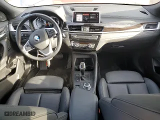 2021 BMW X2 xDrive28i with VIN WBXYJ1C07M5S21169, listed as a Copart auction lot 77829574 with 24,173 mi miles and Salvage Title. Bid and sale history available at carsss.com. Image 8.