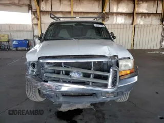 1999 Ford F-250 XL with VIN 1FTNX20FXXEE59499, listed as a Copart auction lot 87511735 with 215,520 mi miles and Salvage title. Bid and sale history available at DreamBid. Image 5.