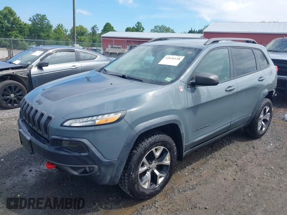 2014 Jeep Cherokee Trailhawk z VIN 1C4PJMBS4EW236950, wystawiony jako IAAI lot #42636128 z przebiegiem 170 491 mil mil oraz . Historia ofert i sprzedaży dostępna na DreamBid. Obrazek 2.