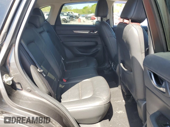 2018 Mazda CX-5 Grand Touring z VIN JM3KFBDM3J0351106, wystawiony jako Copart lot #52553925 z przebiegiem Nie podano mil oraz Szkoda całkowita • Salvage title. Historia ofert i sprzedaży dostępna na DreamBid. Obrazek 12.