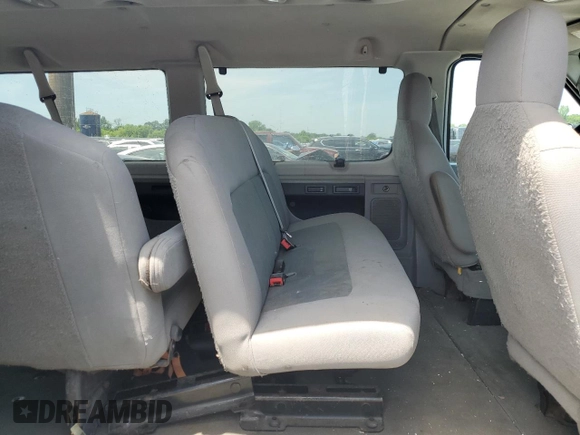 2009 Ford Econoline Passenger XL with VIN 1FBNE31L59DA62487, listed as a Copart auction lot 58073325 with 122,664 mi miles and Salvage title. Bid and sale history available at DreamBid. Image 11.