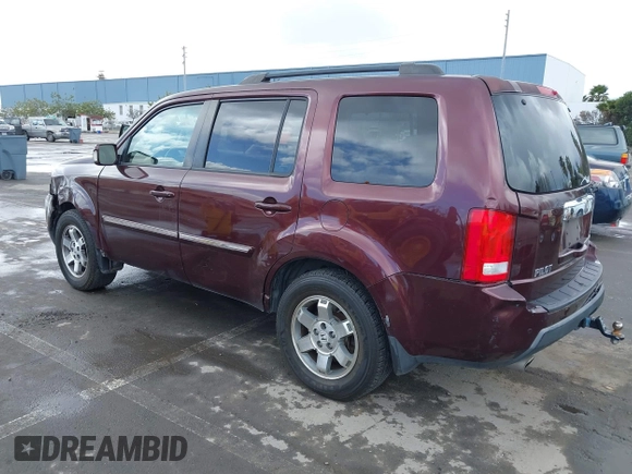 2009 Honda Pilot Touring with VIN 5FNYF48959B007813, listed as a IAAI auction lot 41823645 with 200,571 mi miles and . Bid and sale history available at carsss.com. Image 3.