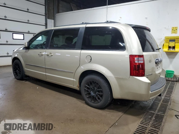 2010 Dodge Grand Caravan Crew with VIN 2D4RN6DX7AR463122, listed as a Copart auction lot 48768635 with 102,497 mi miles and Salvage Title. Bid and sale history available at DreamBid. Image 2.