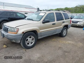 2000 Jeep Grand Cherokee Laredo with VIN 1J4GW48SXYC100248, listed as a IAAI auction lot 42182318 with 227,658 mi miles and . Bid and sale history available at DreamBid. Image 2.