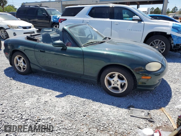 1999 Mazda MX-5 Miata with VIN JM1NB3530X0118452, listed as a Copart auction lot 53337575 with 150,574 mi miles and Clean title. Bid and sale history available at DreamBid. Image 4.