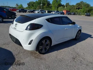 2014 Hyundai Veloster with VIN KMHTC6AD5EU193136, listed as a IAAI auction lot 41836596 with 160,460 mi miles. Bid and sale history available at carsss.com. Image 4.