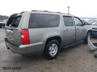 2009 Chevrolet Suburban LT w/2LT with VIN 1GNFC26J39R236980, listed as a IAAI auction lot 41721772 with 215,684 mi miles. Bid and sale history available at carsss.com. Image 4.