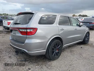 2018 Dodge Durango SRT with VIN 1C4SDJGJ5JC256006, listed as a IAAI auction lot 41038356 with 71,385 mi miles and . Bid and sale history available at DreamBid. Image 4.