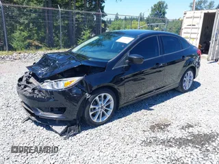 2018 Ford Focus SE z VIN 1FADP3FE5JL279274, wystawiony jako IAAI lot #42626587 z przebiegiem 92 110 mil mil oraz . Historia ofert i sprzedaży dostępna na DreamBid. Obrazek 19.