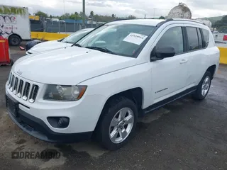 2014 Jeep Compass Altitude with VIN 1C4NJCBA8ED606589, listed as a IAAI auction lot 41939914 with 148,281 mi miles. Bid and sale history available at carsss.com. Image 2.