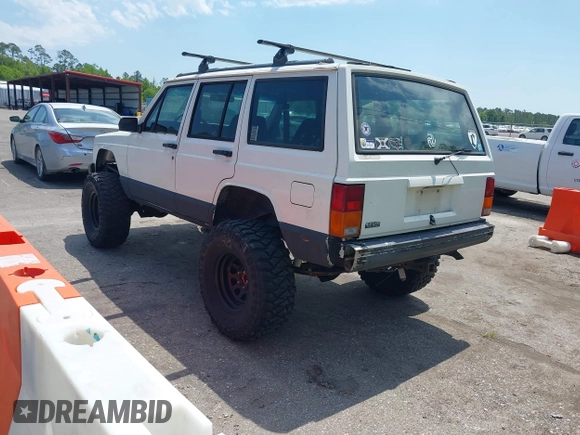 1996 Jeep Cherokee Country with VIN 1J4FJ78SXTL189940, listed as a IAAI auction lot 42020459 with 181,035 mi miles. Bid and sale history available at carsss.com. Image 3.