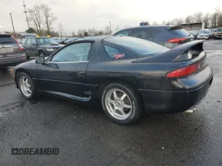 1998 Mitsubishi 3000GT GT z VIN JA3AM84J6WY002600, wystawiony jako Copart lot #86852624 z przebiegiem 141 204 mil mil oraz Tytuł czysty. Historia ofert i sprzedaży dostępna na DreamBid. Obrazek 2.