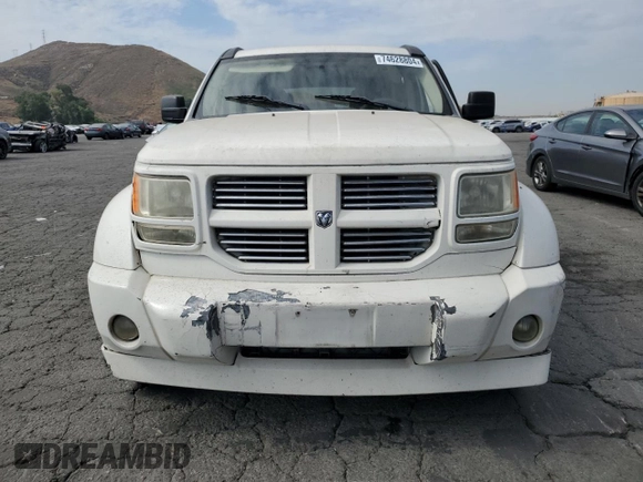 2010 Dodge Nitro SXT z VIN 1D4PT5GK8AW100343, wystawiony jako Copart lot #74628804 z przebiegiem 156 612 mil mil oraz Szkoda całkowita • Salvage title. Historia ofert i sprzedaży dostępna na DreamBid. Obrazek 5.