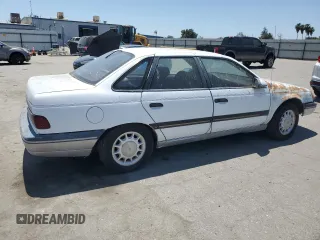 1989 Ford Taurus GL z VIN 1FABP52UXKG244224, wystawiony jako Copart lot #59239225 z przebiegiem 30 853 mil mil oraz Czysty tytuł • Clean title. Historia ofert i sprzedaży dostępna na DreamBid. Obrazek 3.