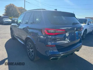 2021 BMW X5 M50i with VIN 5UXJU4C00M9H36466, listed as a Copart auction lot 77444344 with 100,119 mi miles and Clean Title. Bid and sale history available at carsss.com. Image 2.