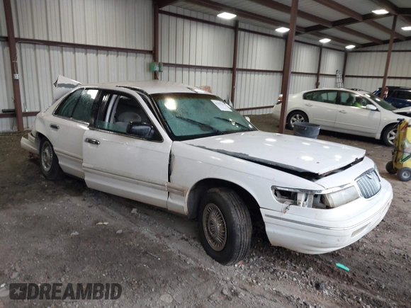 1997 Mercury Grand Marquis GS z VIN 2MELM74W6VX680292, wystawiony jako IAAI lot #42299154 z przebiegiem 208 666 mil mil oraz . Historia ofert i sprzedaży dostępna na DreamBid. Obrazek 1.