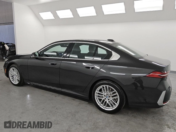 2024 BMW 5 Series 530i xDrive with VIN WBA53FJ05RCS33735, listed as a Copart auction lot 49742795 with 20,986 mi miles and Clean Title. Bid and sale history available at carsss.com. Image 2.