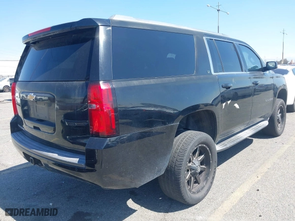 2015 Chevrolet Suburban LT with VIN 1GNSCJKC2FR281629, listed as a IAAI auction lot 41849300 with 133,842 mi miles. Bid and sale history available at carsss.com. Image 4.