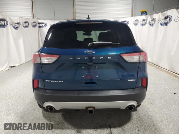 2020 Ford Escape Titanium z VIN 1FMCU9J98LUA93393, wystawiony jako Copart lot #65366925 z przebiegiem 74 750 mil mil oraz Czysty tytuł • Clean title. Historia ofert i sprzedaży dostępna na DreamBid. Obrazek 6.
