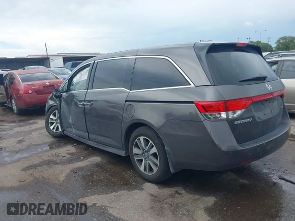 2016 Honda Odyssey Touring Elite with VIN 5FNRL5H97GB010048, listed as a IAAI auction lot 40212711 with 119,009 mi miles and . Bid and sale history available at DreamBid. Image 3.