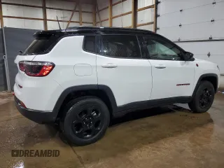 2023 Jeep Compass Trailhawk z VIN 3C4NJDDN1PT527851, wystawiony jako Copart lot #65566035 z przebiegiem 52 811 mil mil oraz Czysty tytuł • Clean title. Historia ofert i sprzedaży dostępna na DreamBid. Obrazek 3.