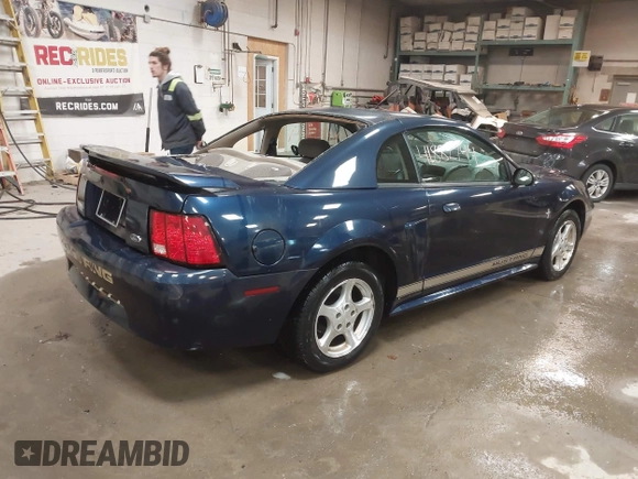 2002 Ford Mustang Standard z VIN 1FAFP40452F117630, wystawiony jako IAAI lot #41882744 z przebiegiem 85 218 mil mil oraz . Historia ofert i sprzedaży dostępna na DreamBid. Obrazek 4.