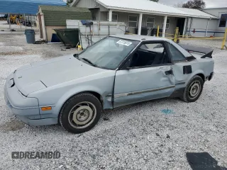 1989 Toyota MR2 z VIN JT2AW15C2K0146245, wystawiony jako Copart lot #87315874 z przebiegiem 162 741 mil mil oraz Tytuł czysty. Historia ofert i sprzedaży dostępna na DreamBid. Obrazek 1.