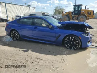 2023 BMW 8 Series M850i z VIN WBAGV8C08PCK41272, wystawiony jako Copart lot #77442574 z przebiegiem Nie podano mil oraz Szkoda całkowita • Salvage title. Historia ofert i sprzedaży dostępna na DreamBid. Obrazek 4.