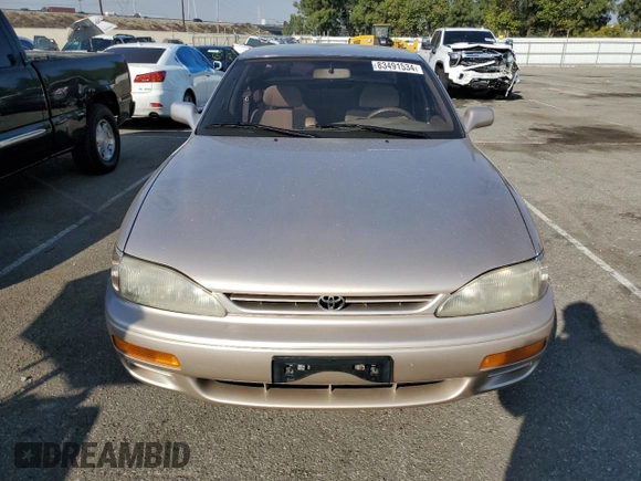 1995 Toyota Camry LE with VIN JT2GK12E7S0107467, listed as a Copart auction lot 83491534 with 112,971 mi miles and Salvage Title. Bid and sale history available at carsss.com. Image 5.