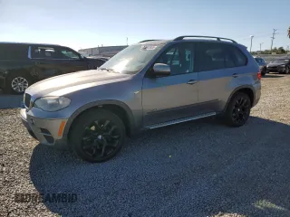 2012 BMW X5 35i z VIN 5UXZV4C54CL992295, wystawiony jako Copart lot #66330985 z przebiegiem 150 686 mil mil oraz Czysty tytuł • Clean title. Historia ofert i sprzedaży dostępna na DreamBid. Obrazek 1.