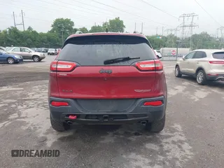 2015 Jeep Cherokee Trailhawk with VIN 1C4PJMBSXFW667469, listed as a IAAI auction lot 42438006 with 127,136 mi miles and . Bid and sale history available at DreamBid. Image 17.