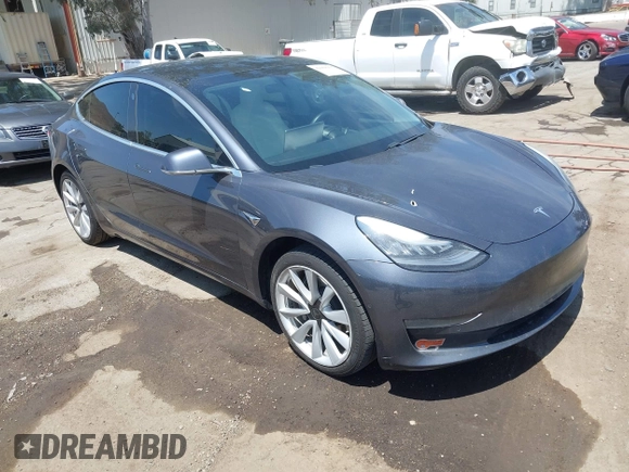 2020 Tesla Model 3 Standard Range Plus with VIN 5YJ3E1EAXLF615781, listed as a IAAI auction lot 42068935 with 96,026 mi miles. Bid and sale history available at carsss.com. Image 1.